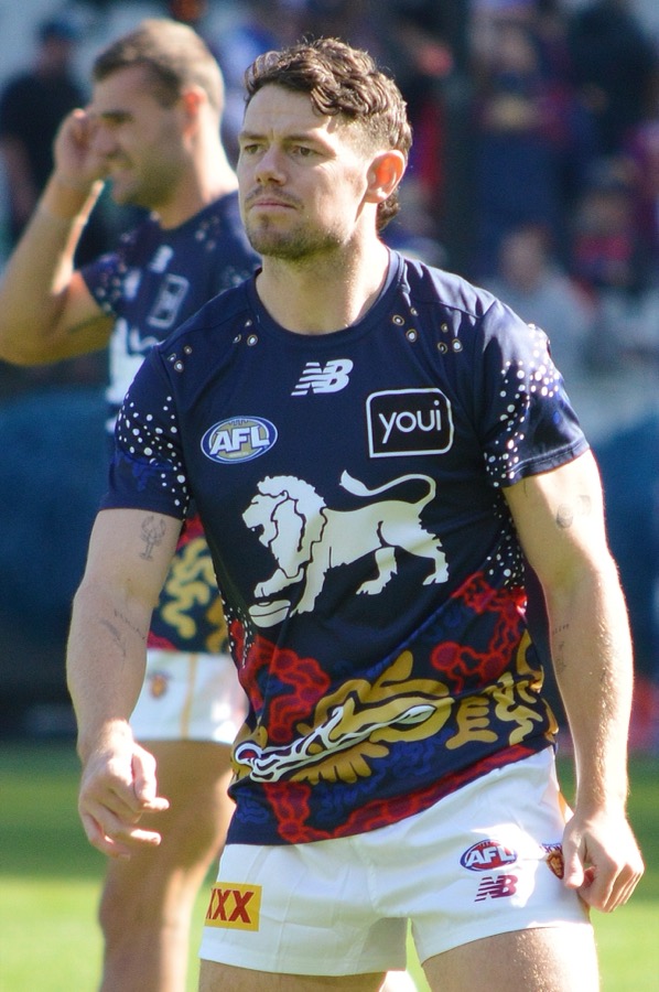 Lachie Neale in Brisbane Lions playing kit, looking focused during a match at the MCG